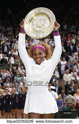 Stock Photograph - "Winners ceremony, champion Serena Williams, USA, holding the winner's silver salver, women's final, Wimbledon Championships 2012 AELTC, ITF Grand Slam Tennis Tournament, London, England, United Kingdom, Europe". Fotosearch