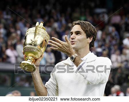 "Winners ceremony, Roger Federer, SUI, holding the trophy, throwing a kiss in the direction of his family, men's final, Wimbledon Championships 2012 AELTC, ITF Grand Slam Tennis Tournament, London, England, United Kingdom, Europe" View Large Photo Image Stock Image - "Winners ceremony, Roger Federer, SUI, holding the trophy, throwing a kiss in the direction of his family, men's final, Wimbledon Championships 2012 AELTC, ITF Grand Slam Tennis Tournament, London, England, United Kingdom, Europe". Fotosearch
