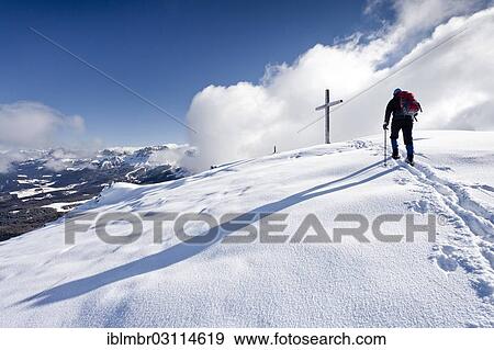 "Winter hiker during ascending Schwarzhorn Mountain on Jochgrimm, here on the summit ridge, Latemar Mountain at the rear, Jochgrimm, Schwarzhorn, South Tyrol province, Trentino-Alto Adige, Italy, Europe" View Large Photo Image Stock Photo - "Winter hiker during ascending Schwarzhorn Mountain on Jochgrimm, here on the summit ridge, Latemar Mountain at the rear, Jochgrimm, Schwarzhorn, South Tyrol province, Trentino-Alto Adige, Italy, Europe". Fotosearch