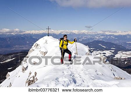 "Winter hiker on the summit ridge while descending from Weisshorn Mountain on Jochgrimm Pass, in front of the summit of Weisshorn Mountain, above the Uberetsch region, Alto Adige, Italy, Europe" View Large Photo Image Stock Image - "Winter hiker on the summit ridge while descending from Weisshorn Mountain on Jochgrimm Pass, in front of the summit of Weisshorn Mountain, above the Uberetsch region, Alto Adige, Italy, Europe". Fotosearch