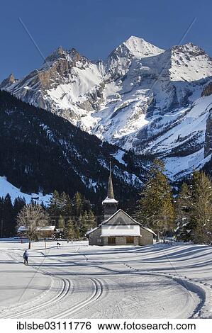 "Winter landscape with cross-country skiers, Blueemlisalp Massif in the middle, St. Mary's Church, Bernese Alps, Kandersteg, Canton of Bern, Switzerland, Europe" View Large Photo Image Stock Photograph - "Winter landscape with cross-country skiers, Blueemlisalp Massif in the middle, St. Mary's Church, Bernese Alps, Kandersteg, Canton of Bern, Switzerland, Europe". Fotosearch