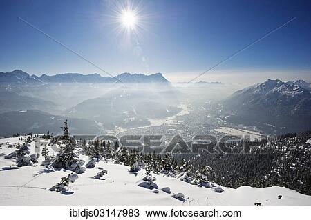 "Winter landscape with snow-covered fir trees and the sun, Wank, Ester Mountains, Upper Bavaria, Bavaria, Germany, Europe" View Large Photo Image Stock Image - "Winter landscape with snow-covered fir trees and the sun, Wank, Ester Mountains, Upper Bavaria, Bavaria, Germany, Europe". Fotosearch