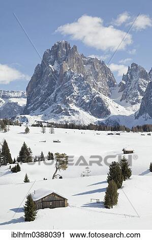 "Winter landscape, wooden cabin at the front, peak of Mt Sasso Lungo or Mt Langkofel at the back, Alpe di Siusi or Seiser Alm, Dolomites, South Tyrol, Alto Adige, Italy, Europe" View Large Photo Image Stock Image - "Winter landscape, wooden cabin at the front, peak of Mt Sasso Lungo or Mt Langkofel at the back, Alpe di Siusi or Seiser Alm, Dolomites, South Tyrol, Alto Adige, Italy, Europe". Fotosearch