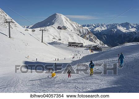 "Winter sports region Silvretta Arena, Ischgl-Samnaun, Restaurant Saalas and cable car stations, behind large cable car station Alp Trida Sattel and Swiss Alps, Samnaun, Graubunden, Austria, Europe" View Large Photo Image Picture - "Winter sports region Silvretta Arena, Ischgl-Samnaun, Restaurant Saalas and cable car stations, behind large cable car station Alp Trida Sattel and Swiss Alps, Samnaun, Graubunden, Austria, Europe". Fotosearch