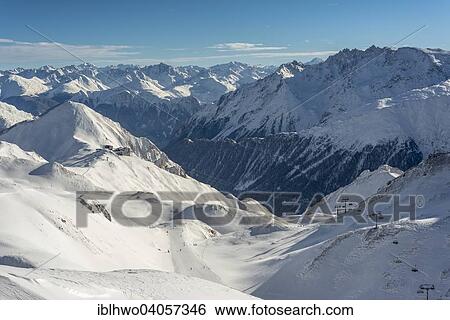 "Winter sports region Silvretta Arena, Ischgl-Samnaun, behind cable car station Alp Trida Sattel and Swiss Alps, Samnaun, Grisons, Switzerland, Europe" View Large Photo Image Stock Photograph - "Winter sports region Silvretta Arena, Ischgl-Samnaun, behind cable car station Alp Trida Sattel and Swiss Alps, Samnaun, Grisons, Switzerland, Europe". Fotosearch