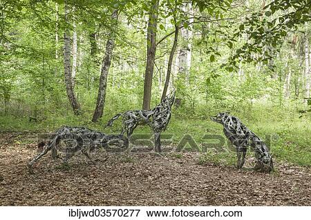 Stock Photo - "Woelfe"""" by Marion Burghouwt, Kunstwanderweg Hoher Flaeming, Wiesenburg, Brandenburg, Germany, Europe". Fotosearch
