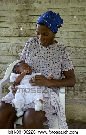 "Woman, 38 years, with baby, 3 months, Village Morin in Leogane, Haiti, North America" View Large Photo Image Stock Image - "Woman, 38 years, with baby, 3 months, Village Morin in Leogane, Haiti, North America". Fotosearch