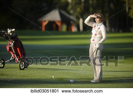 Stock Image - "Woman, 41, playing golf on a golf course, golf resort, Karlovy Vary, Karlovy Vary Region, Bohemia, Czech Republic, Europe". Fotosearch