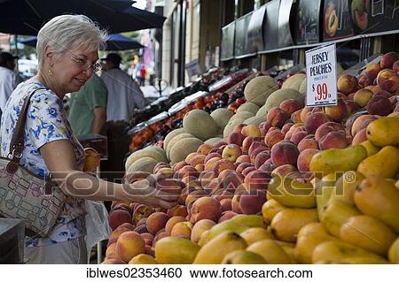 "Woman, 63, shops for peaches at Aspen Marketplace, Hoboken, New Jersey, USA" View Large Photo Image Stock Image - "Woman, 63, shops for peaches at Aspen Marketplace, Hoboken, New Jersey, USA". Fotosearch