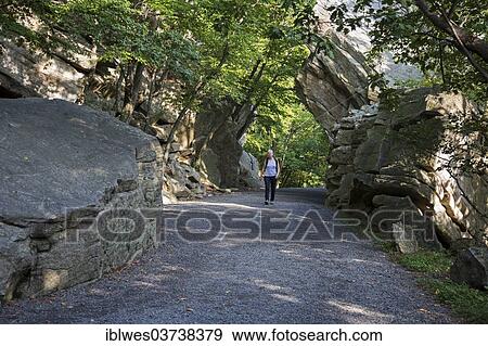 "Woman, 64, hikes the Undercliff Road, Mohonk Preserve nature preserve, Catskill Mountains, New Paltz, New York, United States, North America" View Large Photo Image Stock Photo - "Woman, 64, hikes the Undercliff Road, Mohonk Preserve nature preserve, Catskill Mountains, New Paltz, New York, United States, North America". Fotosearch