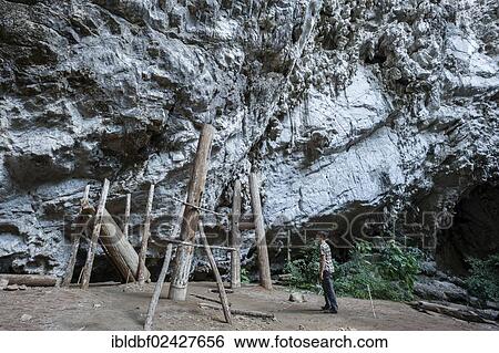 "Woman admiring thousands of years old teak coffins, tomb within a cave, Soppong or Pang Mapha area, Mae Hong Son province, Northern Thailand, Thailand, Asia" View Large Photo Image Stock Photograph - "Woman admiring thousands of years old teak coffins, tomb within a cave, Soppong or Pang Mapha area, Mae Hong Son province, Northern Thailand, Thailand, Asia". Fotosearch
