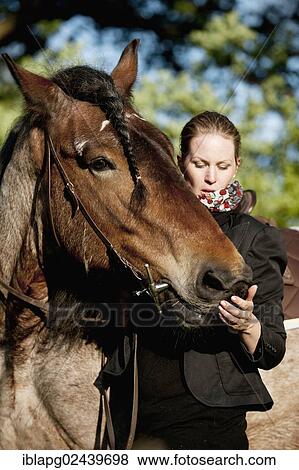 Woman and a Belgian Draft horse View Large Photo Image Stock Photo - Woman and a Belgian Draft horse. Fotosearch