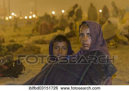 "Woman and child at Kumbha Mela grounds, Allahabad, Uttar Pradesh, India, Asia" View Large Photo Image Stock Photograph - "Woman and child at Kumbha Mela grounds, Allahabad, Uttar Pradesh, India, Asia". Fotosearch