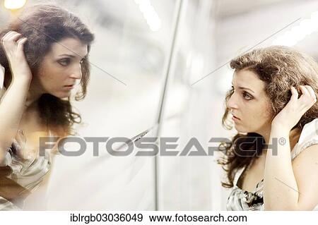 Stock Photo - "Woman and her mirror image, Allgaeu, Kempten, Allgau, Swabia, Bavaria, Germany, Europe". Fotosearch