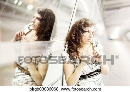 Stock Photo - "Woman and her mirror image, Allgaeu, Kempten, Allgau, Swabia, Bavaria, Germany, Europe". Fotosearch