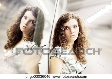 Stock Photograph - "Woman and her mirror image, Allgaeu, Kempten, Allgau, Swabia, Bavaria, Germany, Europe". Fotosearch