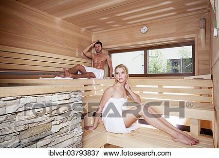 Woman and man sitting in a Finnish wood-fired sauna View Large Photo Image Stock Photo - Woman and man sitting in a Finnish wood-fired sauna. Fotosearch