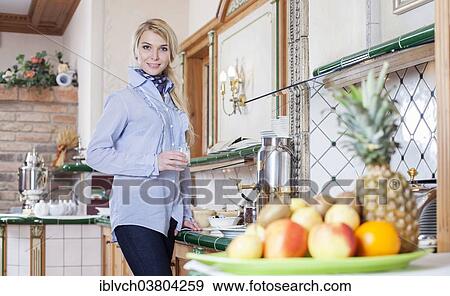 Woman at the breakfast buffet of a hotel View Large Photo Image Stock Photo - Woman at the breakfast buffet of a hotel. Fotosearch
