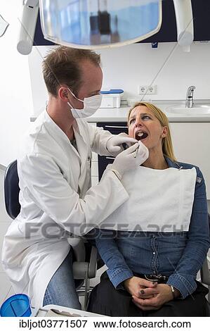 "Woman at the dentist, dentist checking her teeth, Germany, Europe" View Large Photo Image Stock Photo - "Woman at the dentist, dentist checking her teeth, Germany, Europe". Fotosearch