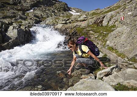 "Woman at the Gradenbach stream, High Tauern or Hohe Tauern National Park, Carinthia, Austria, Europe" View Large Photo Image Stock Photo - "Woman at the Gradenbach stream, High Tauern or Hohe Tauern National Park, Carinthia, Austria, Europe". Fotosearch