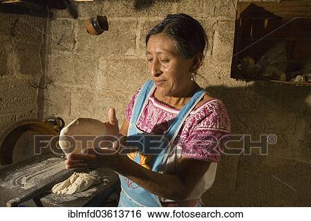 "Woman baking tortillas, village of San Miguel, Cuetzalan, Puebla, Mexico, North America" View Large Photo Image Stock Photograph - "Woman baking tortillas, village of San Miguel, Cuetzalan, Puebla, Mexico, North America". Fotosearch