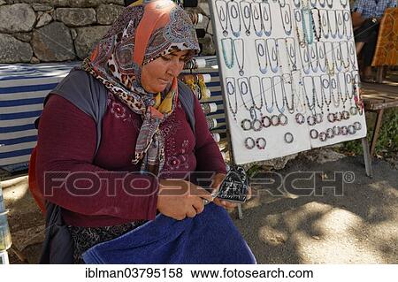 Stock Photo - "Woman carving a stone, ancient city of Tlos in the Xanthos Valley, Mugla Province, Lycia, Aegean, Turkey, Asia". Fotosearch