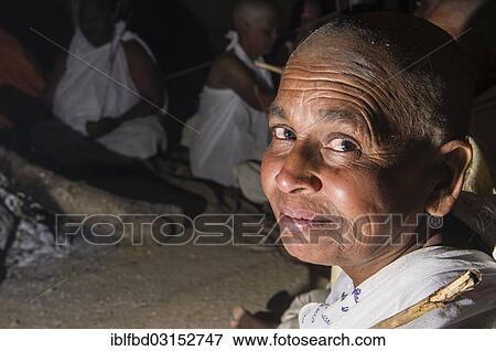 Stock Photo - "Woman during the initiation of new Jain nuns, during Kumbha Mela festival, at night, Allahabad, Uttar Pradesh, India, Asia". Fotosearch