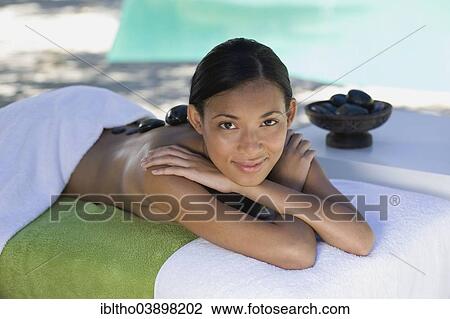 "Woman enjoying a wellness and spa treatment, South Africa, Africa" View Large Photo Image Stock Image - "Woman enjoying a wellness and spa treatment, South Africa, Africa". Fotosearch
