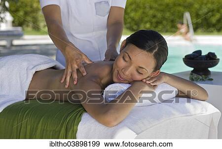 "Woman enjoying a wellness and spa treatment, South Africa, Africa" View Large Photo Image Stock Photo - "Woman enjoying a wellness and spa treatment, South Africa, Africa". Fotosearch