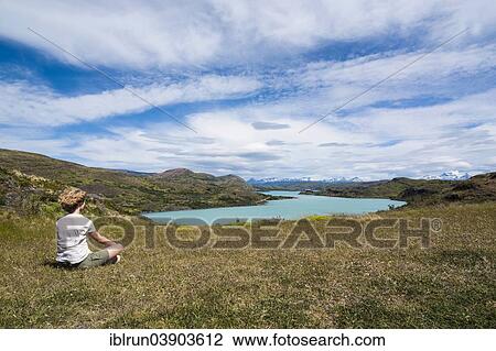 "Woman enjoying the view of a glacier lake, Torres del Paine National Park, Patagonia" View Large Photo Image Stock Image - "Woman enjoying the view of a glacier lake, Torres del Paine National Park, Patagonia". Fotosearch