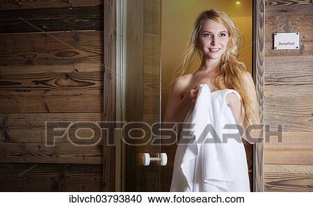 Woman exiting a steam room View Large Photo Image Stock Image - Woman exiting a steam room. Fotosearch
