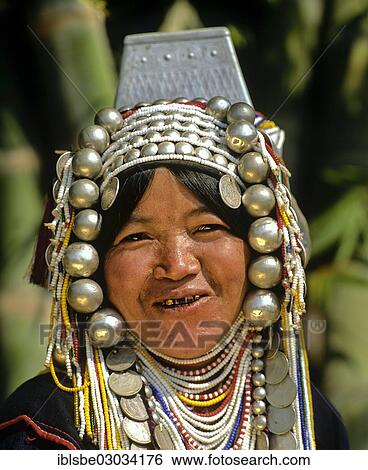 "Woman from the people of the Akha wearing traditional costume with a headdress, Tachilek, Shan State, Myanmar, Burma, Asia" View Large Photo Image Stock Photograph - "Woman from the people of the Akha wearing traditional costume with a headdress, Tachilek, Shan State, Myanmar, Burma, Asia". Fotosearch