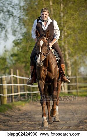 Woman galloping on an Oldenburg horse View Large Photo Image Stock Photo - Woman galloping on an Oldenburg horse. Fotosearch