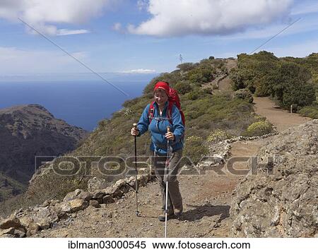 "Woman hiking above the Valle Gran Rey valley, La Gomera, Valle Gran Rey, Canary Islands, Spain, Europe" View Large Photo Image Stock Photography - "Woman hiking above the Valle Gran Rey valley, La Gomera, Valle Gran Rey, Canary Islands, Spain, Europe". Fotosearch