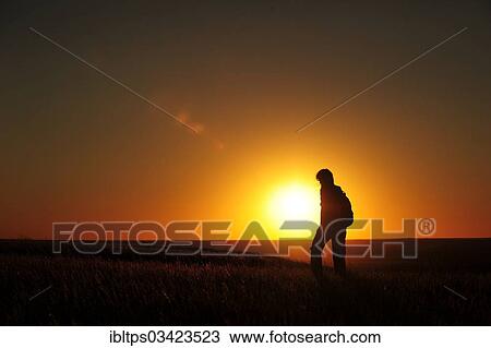 "Woman hiking at sunset through the prairie, Grasslands Nationalpark, Saskatchewan Province, Canada, North America" View Large Photo Image Stock Image - "Woman hiking at sunset through the prairie, Grasslands Nationalpark, Saskatchewan Province, Canada, North America". Fotosearch