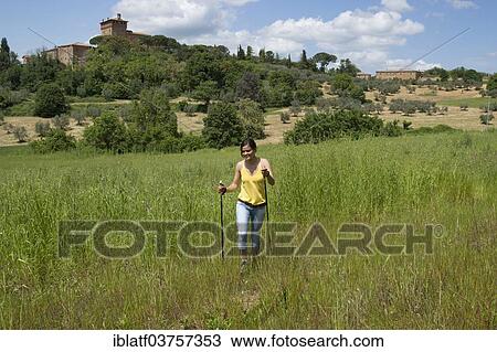 "Woman hiking, behind the Palazzo Massani winery, near San Quirico d'Orcia, Tuscany, Italy, Europe" View Large Photo Image Stock Image - "Woman hiking, behind the Palazzo Massani winery, near San Quirico d'Orcia, Tuscany, Italy, Europe". Fotosearch