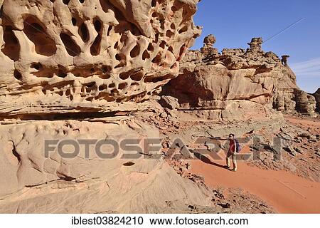 "Woman hiking in the rocky landscape of the Cirque, Tadrart region, Tassili n'Ajjer National Park, Unesco World Heritage Site, Algeria, Sahara, North Africa, Africa" View Large Photo Image Stock Image - "Woman hiking in the rocky landscape of the Cirque, Tadrart region, Tassili n'Ajjer National Park, Unesco World Heritage Site, Algeria, Sahara, North Africa, Africa". Fotosearch