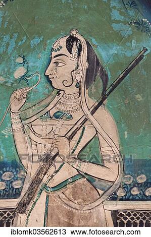 "Woman holding a gun and a flower, wall painting or fresco painted with natural colours from the Bundikalam school of painting, Chitrashala or Pavilion of the Paintings, Taragarh Fort, Bundi, Rajasthan, India, Asia" View Large Photo Image Stock Image - "Woman holding a gun and a flower, wall painting or fresco painted with natural colours from the Bundikalam school of painting, Chitrashala or Pavilion of the Paintings, Taragarh Fort, Bundi, Rajasthan, India, Asia". Fotosearch