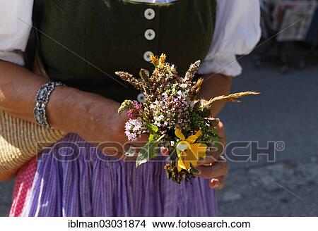 "Woman holding a herbal bouquet to be blessed for the Assumption of the Virgin Mary, Sankt Gilgen, Salzkammergut, Salzburg State, Austria, Europe" View Large Photo Image Picture - "Woman holding a herbal bouquet to be blessed for the Assumption of the Virgin Mary, Sankt Gilgen, Salzkammergut, Salzburg State, Austria, Europe". Fotosearch