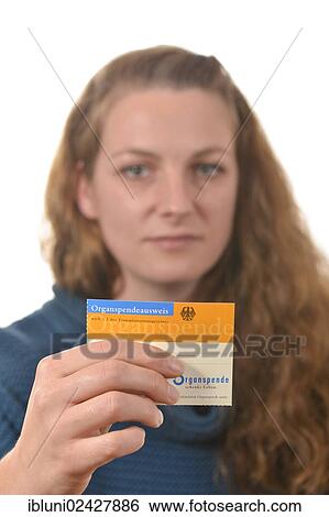 Woman holding an organ donor card View Large Photo Image Stock Photograph - Woman holding an organ donor card. Fotosearch
