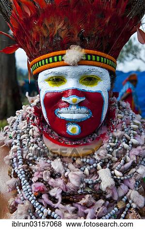 "Woman in a colourfully decorated costume with face paint at the traditional sing-sing gathering, Hochland, Mount Hagen, Western Highlands Province, Papua New Guinea, Oceania" View Large Photo Image Stock Photo - "Woman in a colourfully decorated costume with face paint at the traditional sing-sing gathering, Hochland, Mount Hagen, Western Highlands Province, Papua New Guinea, Oceania". Fotosearch