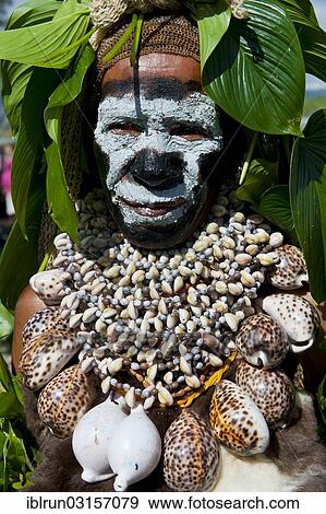 "Woman in a colourfully decorated costume with face paint at the traditional sing-sing gathering, Hochland, Mount Hagen, Western Highlands Province, Papua New Guinea, Oceania" View Large Photo Image Stock Photo - "Woman in a colourfully decorated costume with face paint at the traditional sing-sing gathering, Hochland, Mount Hagen, Western Highlands Province, Papua New Guinea, Oceania". Fotosearch