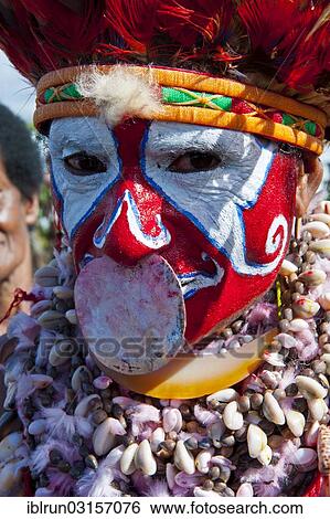 "Woman in a colourfully decorated costume with face paint celebrating the traditional sing-sing gathering, Hochland, Mount Hagen, Western Highlands Province, Papua New Guinea, Oceania" View Large Photo Image Stock Photograph - "Woman in a colourfully decorated costume with face paint celebrating the traditional sing-sing gathering, Hochland, Mount Hagen, Western Highlands Province, Papua New Guinea, Oceania". Fotosearch