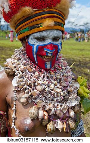 "Woman in a colourfully decorated costume with face paint at the traditional sing-sing gathering, Hochland, Mount Hagen, Western Highlands Province, Papua New Guinea, Oceania" View Large Photo Image Stock Photography - "Woman in a colourfully decorated costume with face paint at the traditional sing-sing gathering, Hochland, Mount Hagen, Western Highlands Province, Papua New Guinea, Oceania". Fotosearch