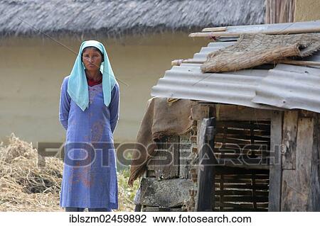 Stock Image - "Woman in a deprived village near Birathnagar, Terai region, Nepal, Asia". Fotosearch