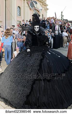 "Woman in a lavish black costume with a hat and a silver mask, Venetian Fair, Ludwigsburg, Baden-Wuerttemberg, Germany, Europe" View Large Photo Image Stock Photograph - "Woman in a lavish black costume with a hat and a silver mask, Venetian Fair, Ludwigsburg, Baden-Wuerttemberg, Germany, Europe". Fotosearch