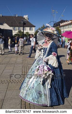 "Woman in a Rococo costume with an umbrella, masks and a flower basked, Venetian Fair, Ludwigsburg, Baden-Wuerttemberg, Germany, Europe" View Large Photo Image Stock Photo - "Woman in a Rococo costume with an umbrella, masks and a flower basked, Venetian Fair, Ludwigsburg, Baden-Wuerttemberg, Germany, Europe". Fotosearch
