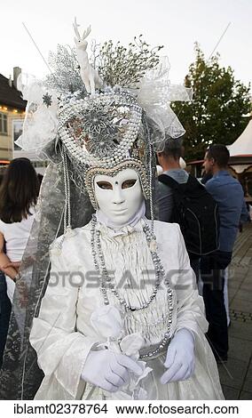 "Woman in a white costume with a white mask and a large headdress, Venetian Fair, Ludwigsburg, Baden-Wuerttemberg, Germany, Europe" View Large Photo Image Picture - "Woman in a white costume with a white mask and a large headdress, Venetian Fair, Ludwigsburg, Baden-Wuerttemberg, Germany, Europe". Fotosearch