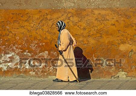 "Woman in traditional dress, djellaba and headscarf, in the Medina or historic centre, Marrakech, Morocco, Africa" View Large Photo Image Stock Photograph - "Woman in traditional dress, djellaba and headscarf, in the Medina or historic centre, Marrakech, Morocco, Africa". Fotosearch