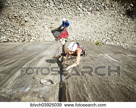 "Woman lead climbing a gully, crack in the rock, Martinswand climbing area, Zirl, Tyrol, Austria, Europe" View Large Photo Image Stock Photo - "Woman lead climbing a gully, crack in the rock, Martinswand climbing area, Zirl, Tyrol, Austria, Europe". Fotosearch